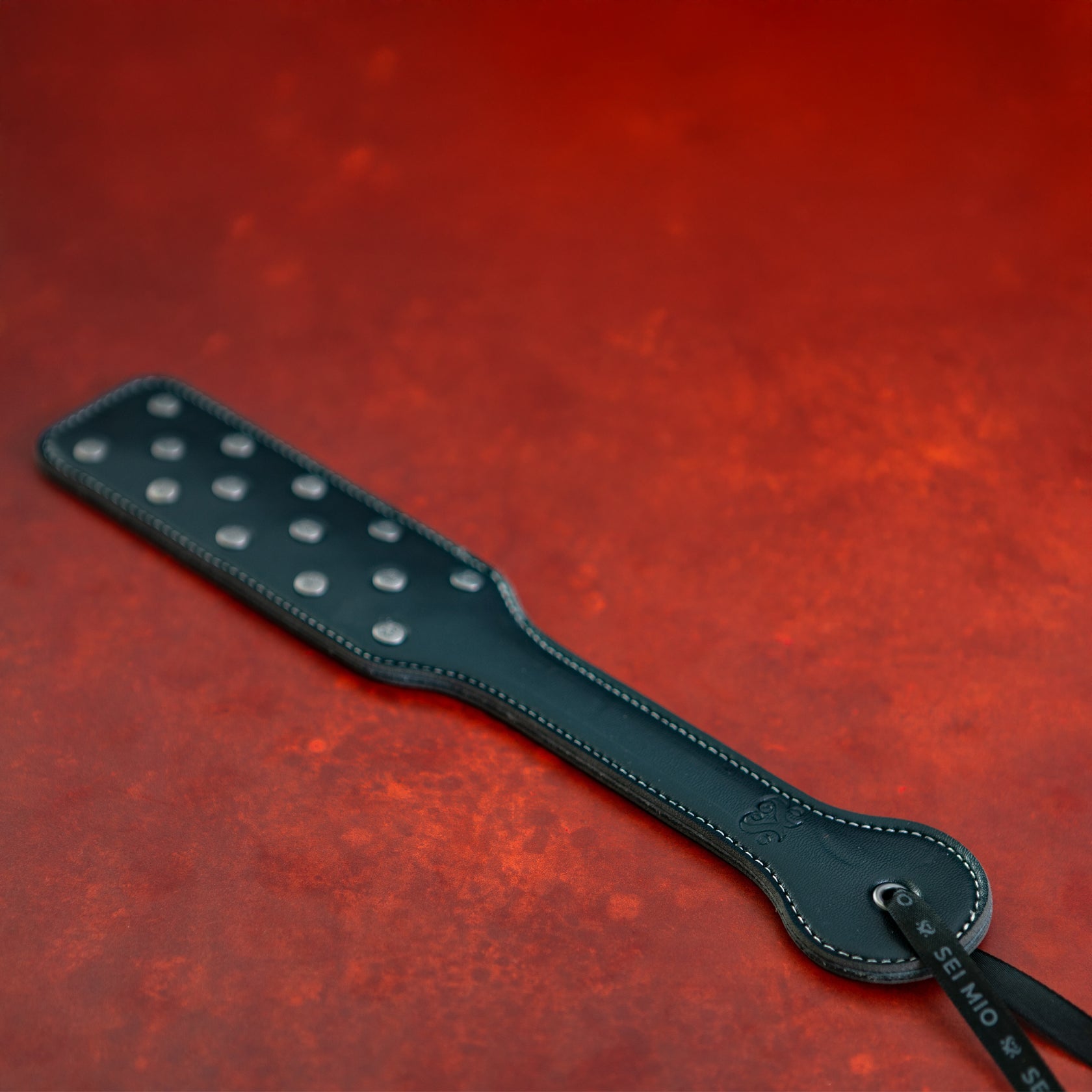 Sei Mio Studdy Hard Leather Punishment Paddle with Metal Studs – Black